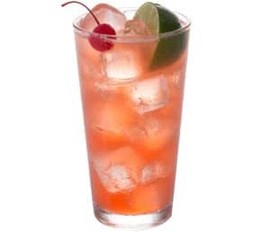 A refreshing red fruit drink with ice, a cherry, and a lime garnish in a tall glass.