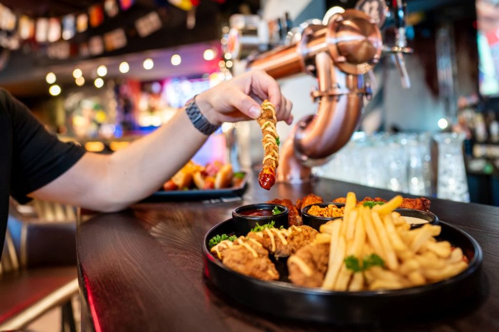 crispy chicken nuggets served with fries and dipping sauces in a restaurant
